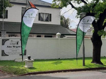 Alec Wright'S Guest Lodge, Flag, House, Building, Architecture, Sign, Cemetery, Religion, Grave, Golfing, Ball Game, Sport