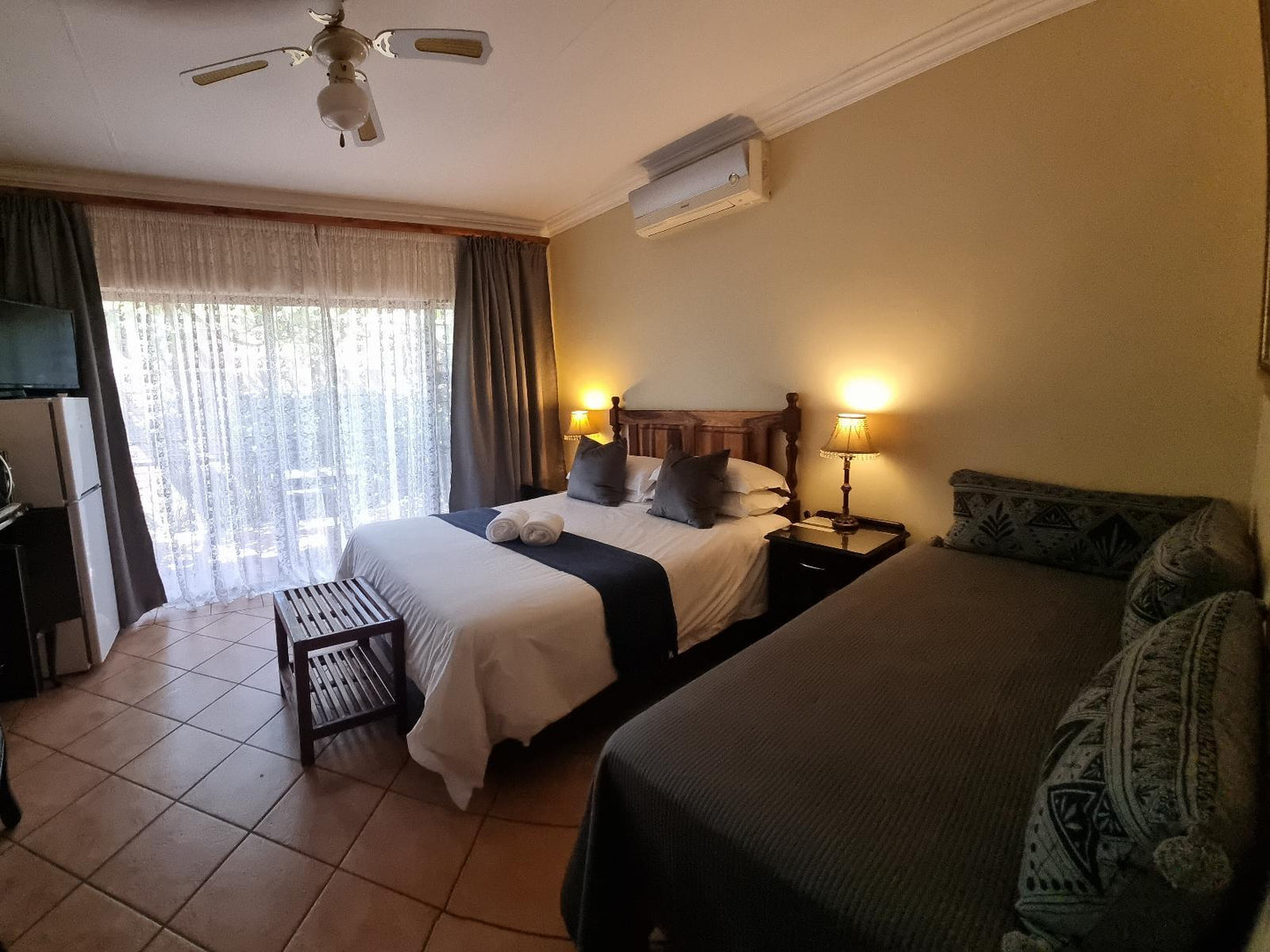 Deluxe Tri-room with private patio @ Camelia Guest House