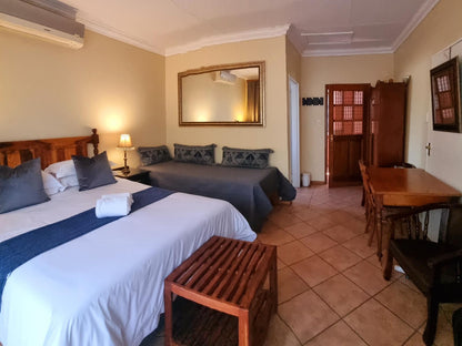 Deluxe Tri-room with private patio @ Camelia Guest House