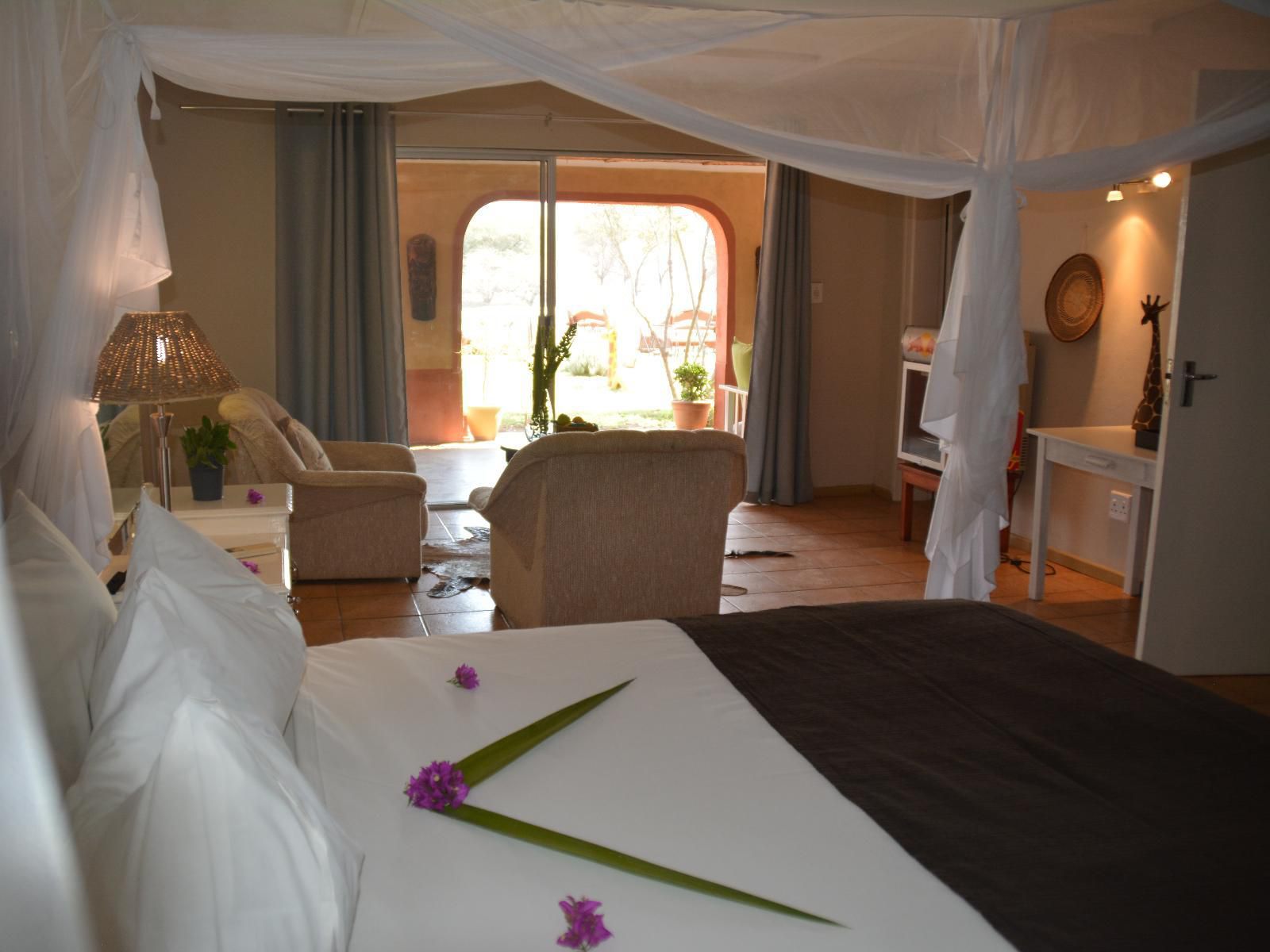 Gabus Safari Lodge, Luxury Room with Waterhole View, Bedroom