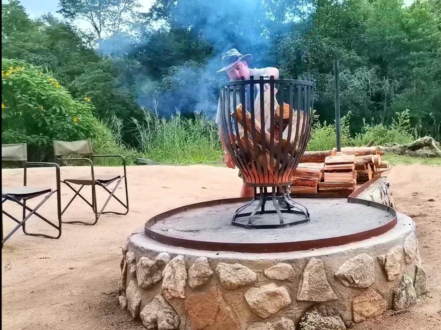 Lions Rock Rapids Lodge And Luxury Tented Camp, Face, Person, One Face, Fire, Nature, Fireplace, Meat, Food, Frontal Face, Male, Adult, Eyes Closed, Beard