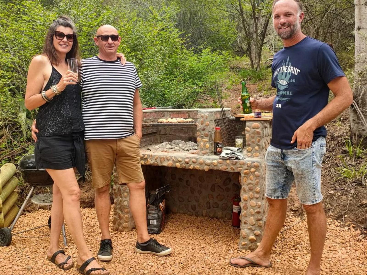 The Gaia Sanctuary, Face, Person, Three Faces, Group, Beer, Drink, Bottle, Drinking Accessoire, Food, Frontal Face, Female, Adult, Smile, Sunglasses, Male, Eyes Open, Beard